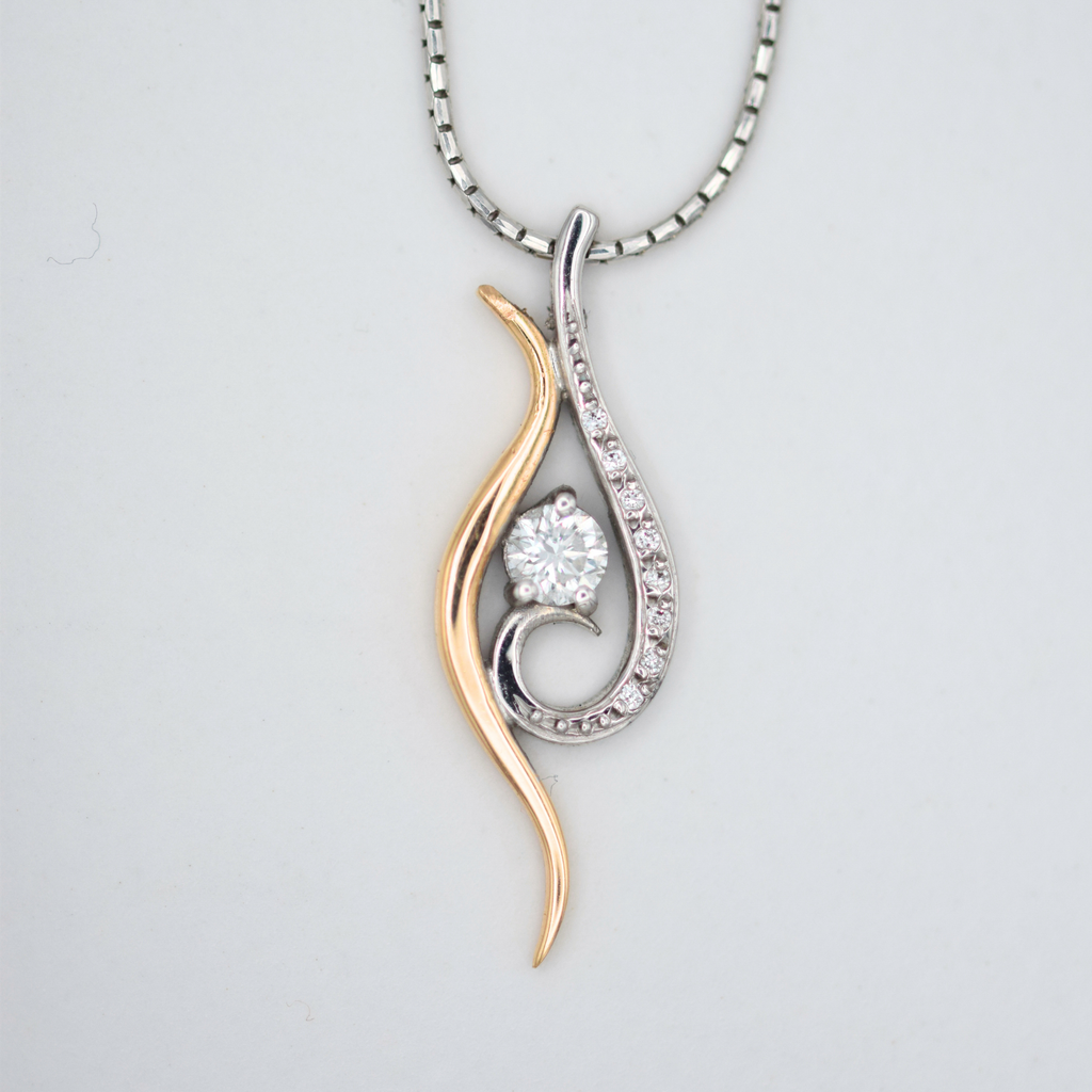 18k rose gold and white gold swirl necklace with rbc diamonds