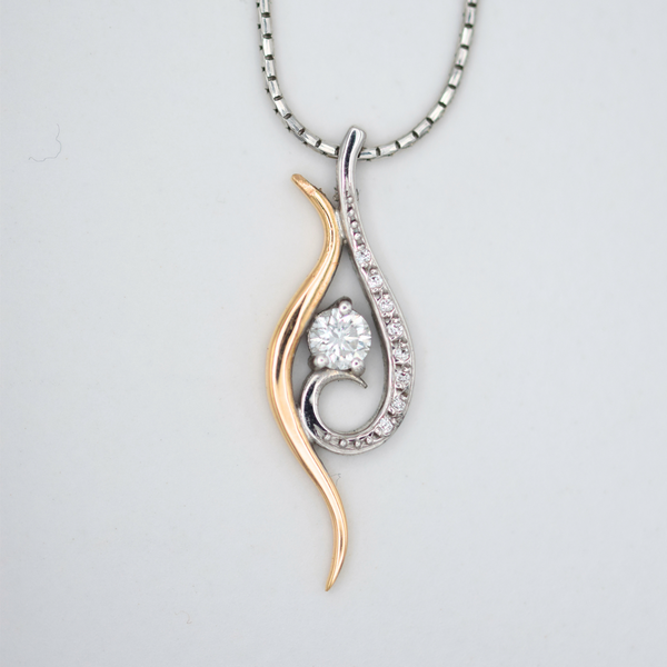 18k rose gold and white gold swirl necklace with rbc diamonds