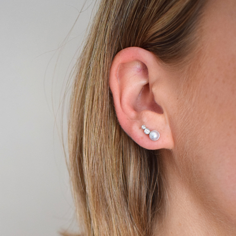 pearl and diamond earring modelled