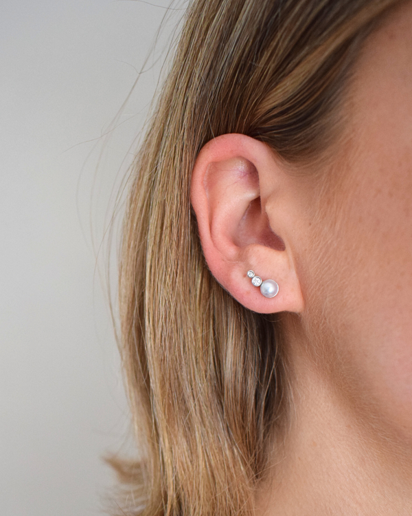 pearl and diamond earring modelled