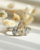 champagne diamond with two white diamond side stones bezel set platinum ring