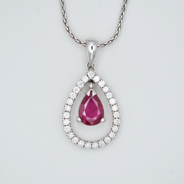 dancing pear ruby with diamond set halo necklace