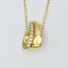 diamond set solid 18k yellow gold curled pendant