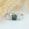 fairy style ring with octagon cut teal sapphire and marquise and pear diamond shoulders