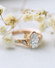 lab-grown pear diamond with marquise and round natural diamond side stones in 18k rose gold side shot