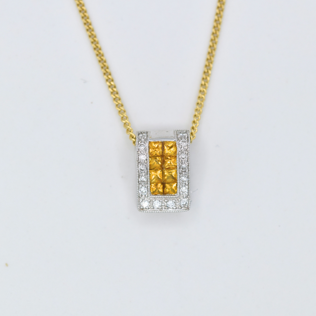 orange sapphire and diamond pendant with yellow gold chain