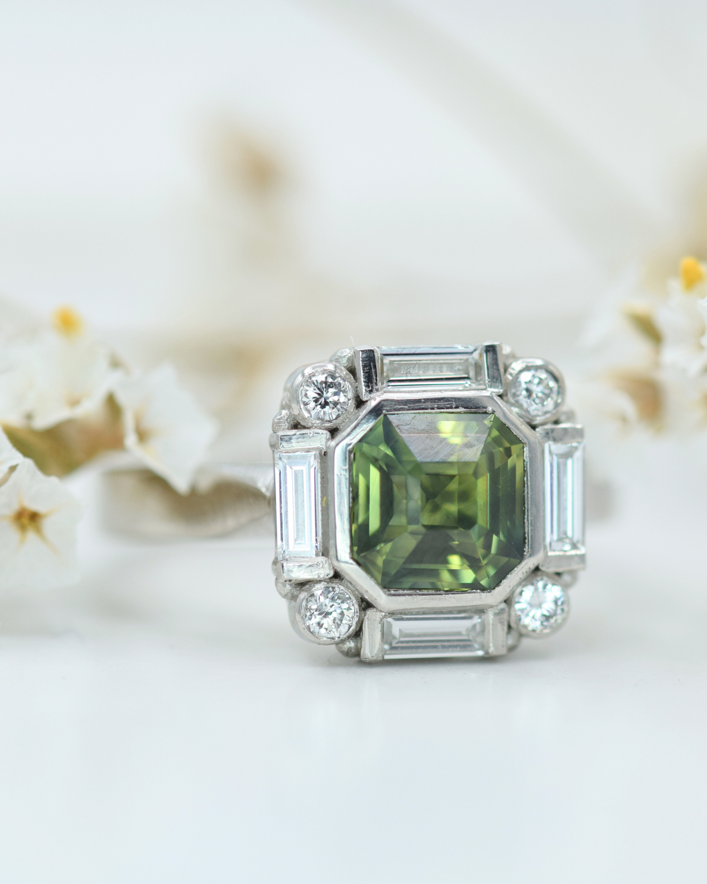 platinum-green-sapphire-with-diamond-border