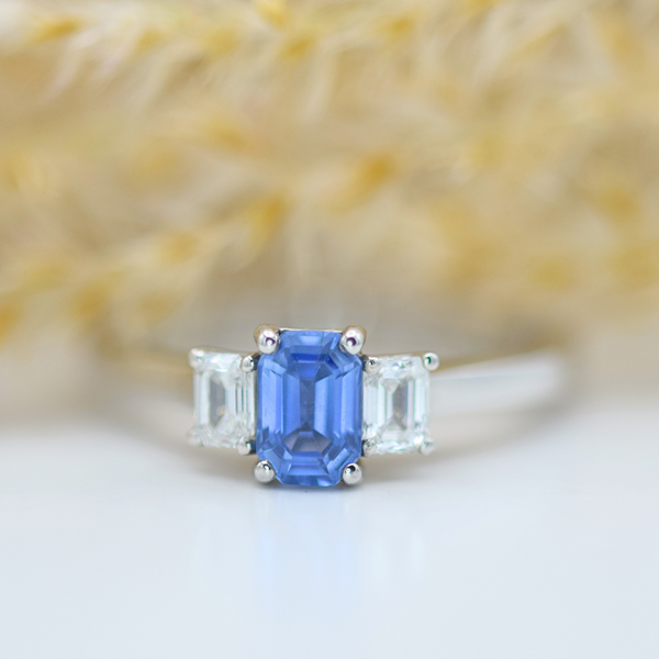 platinum sapphire and diamond emerald cut three stone ring