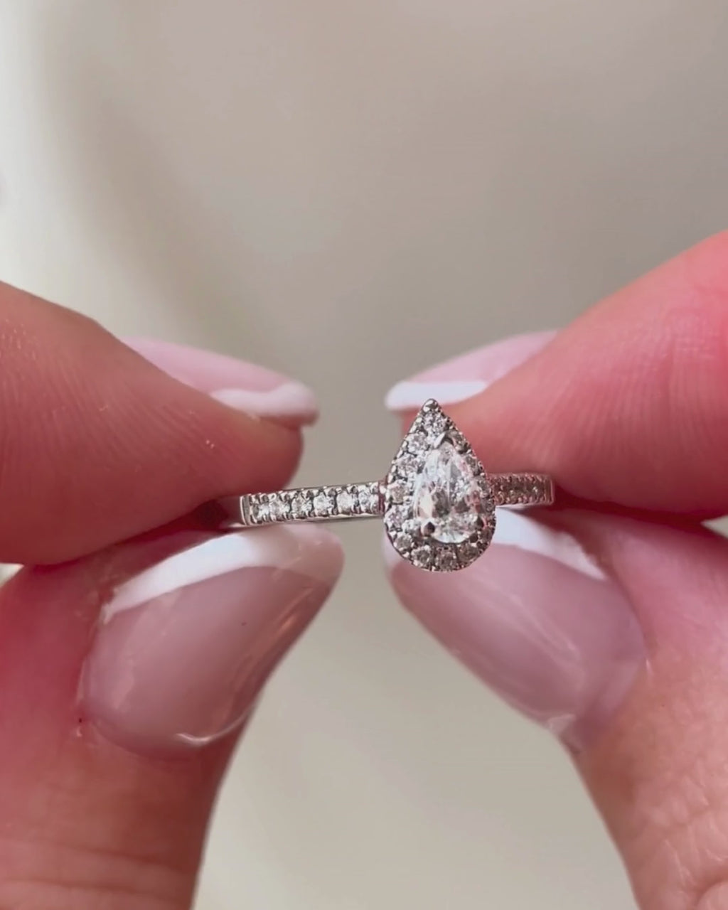 pear diamond halo ring closeup