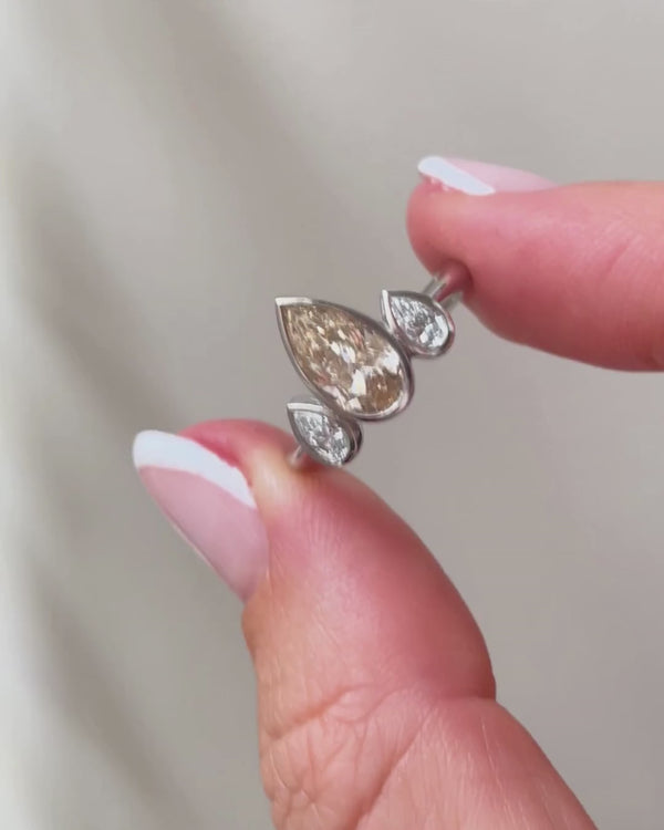champagne and white diamond three stone ring - in fingers