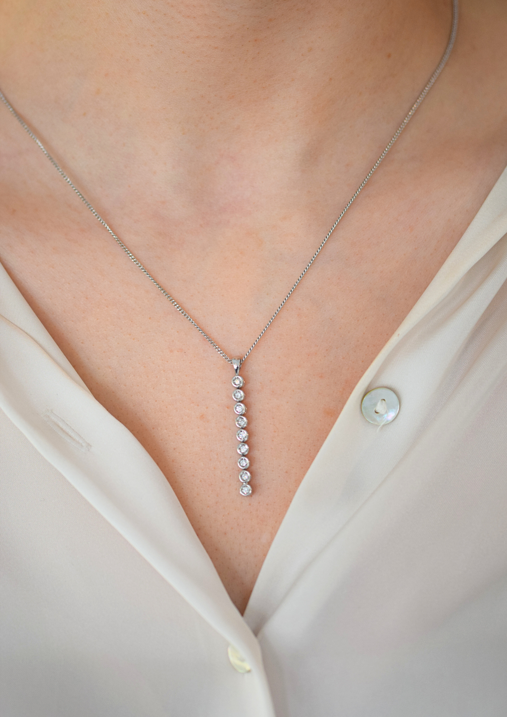 white gold bezel set diamond chain pendant