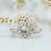 white gold circle of life ring with white diamonds
