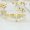 white round and pear diamond soft curve wedding band in yellow gold