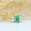 yellow gold emerald cut emerald and diamond three stone ring