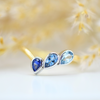 yellow gold sapphire topaz and aquamarine asymmetrical wishbone ring